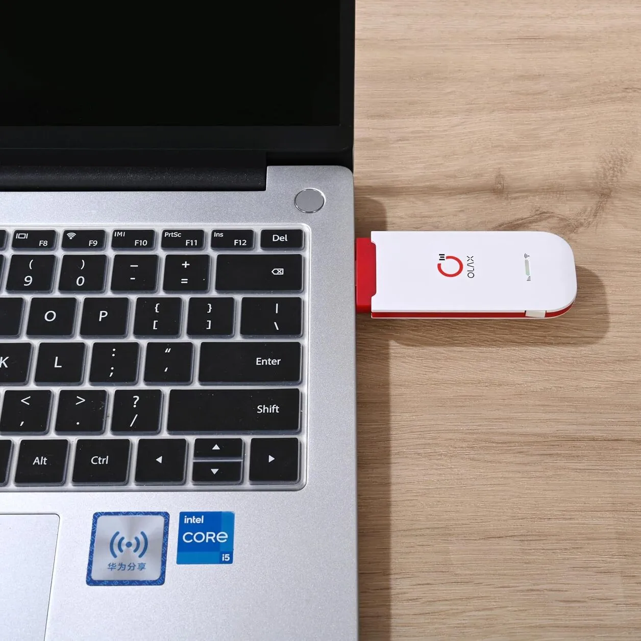 Plugging the dongle into a USB port to power it on